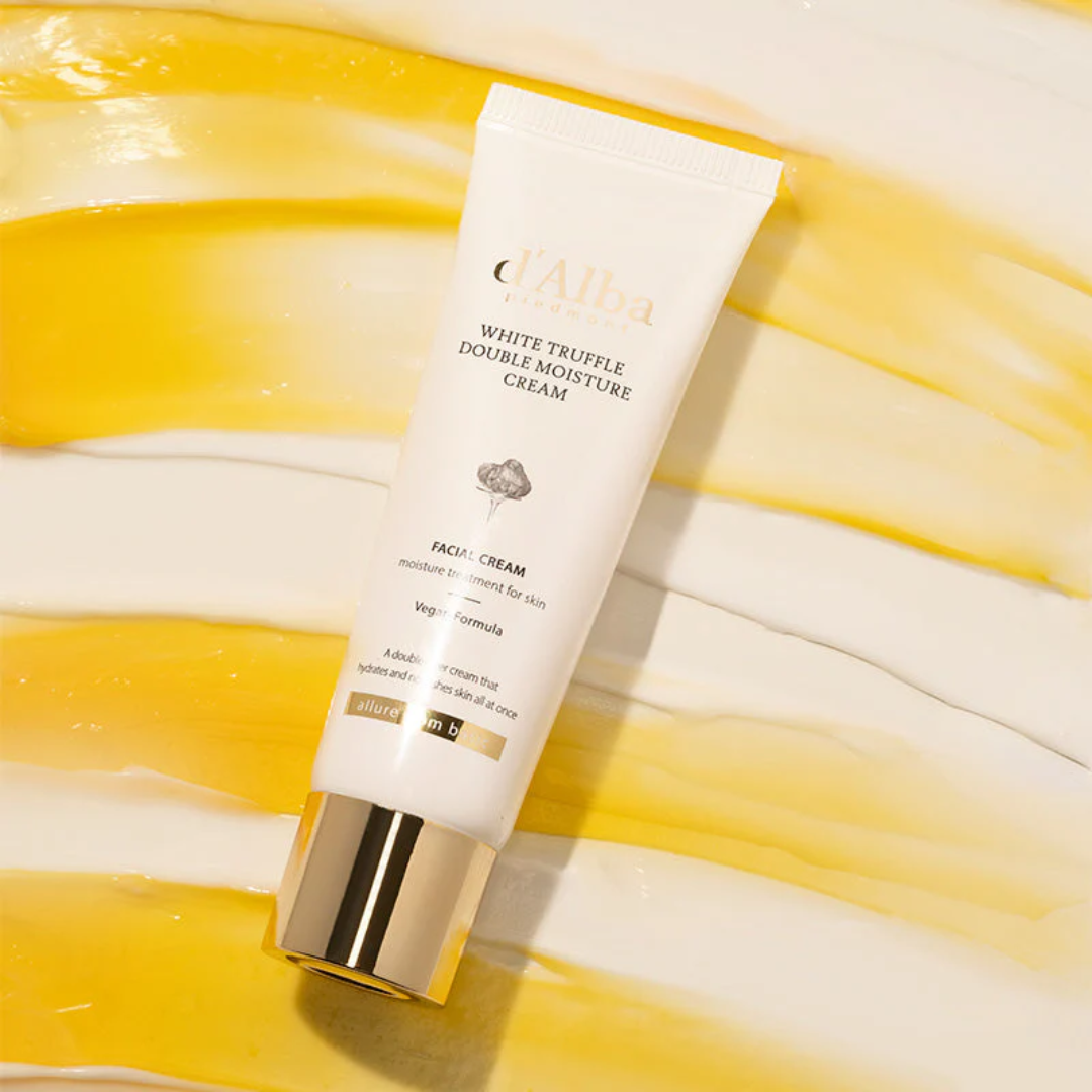 Tube of white truffle double moisture cream on a yellow and white striped fabric background