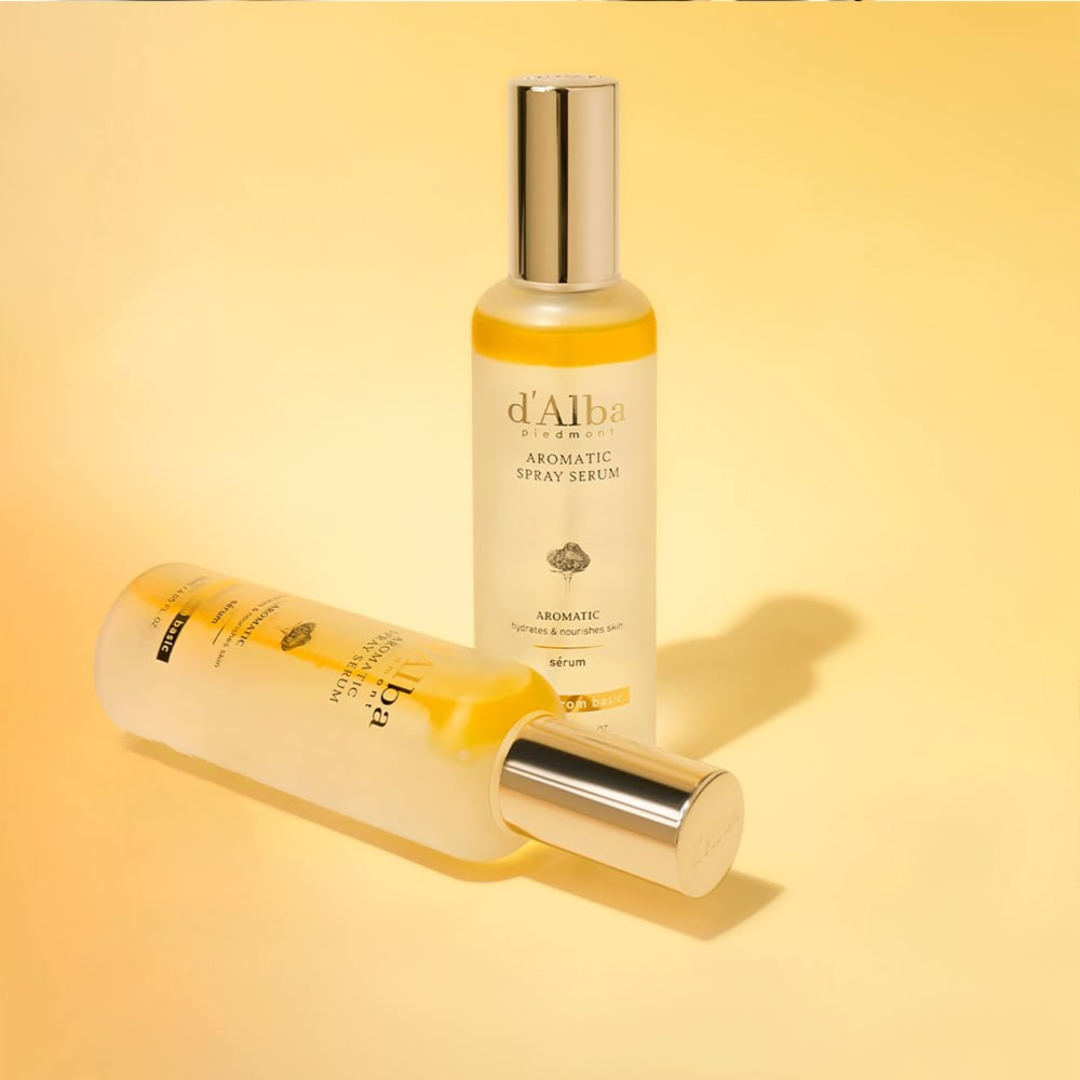 Two bottles of d'Alba Aromatic Elixir on a yellow background